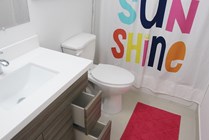 Upgraded bathrooms include extra storage drawers in vanity.