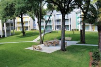 Wide open greenspace and outdoor seating.