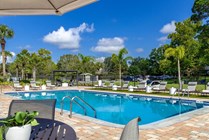 Experience succulent leisure anytime on our expansive sundeck adorned with modern loungers, umbrellaed tables, and a delightful pergola.