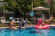 Dive into joy with friends and family at our sparkling swimming pool. 